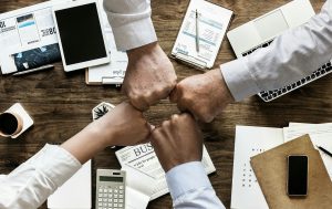 4 people hand joining together